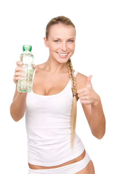 Vacker kvinna med en flaska vatten Stockfoto
