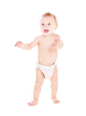 Standing baby boy in diaper clipart