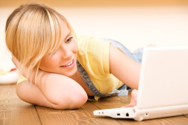 Teenage girl with laptop computer clipart