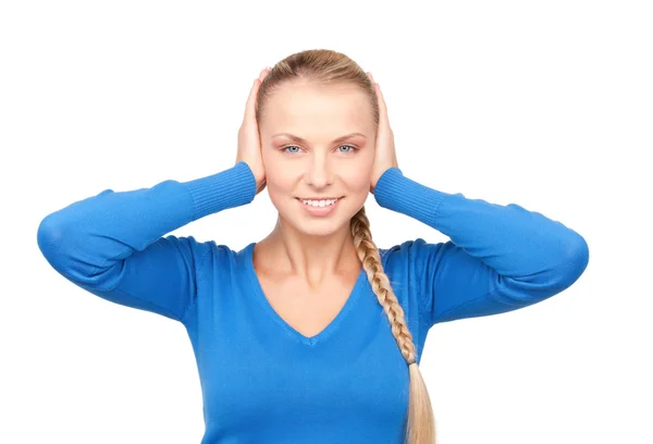 Smiling woman with hands over ears — Stock Photo, Image