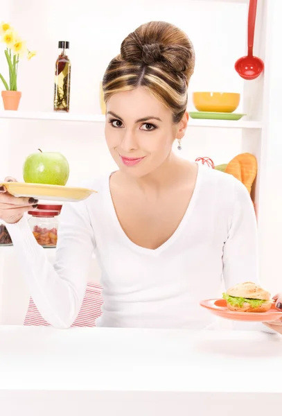 Woman with green apple and sandwich Stock Photo