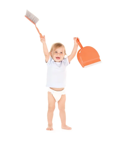 Baby boy with with dustpan and brush — Stock Photo, Image