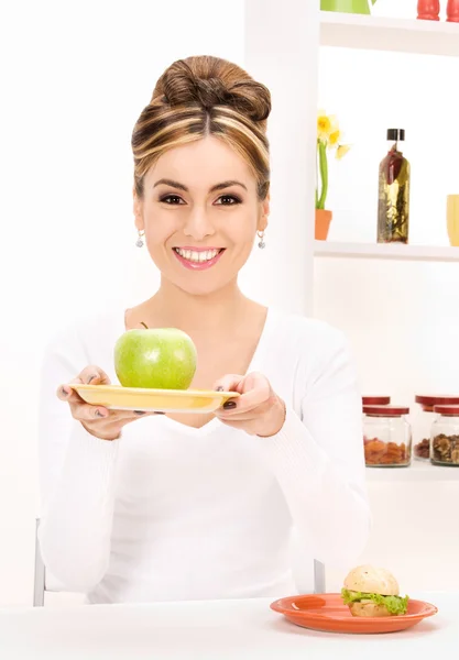 Woman with green apple and sandwich Royalty Free Stock Images