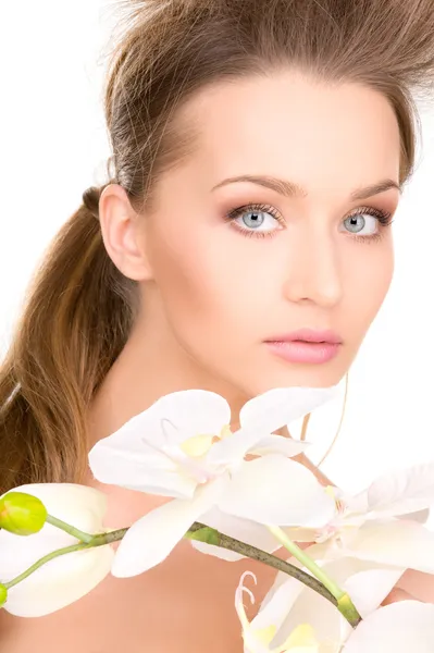 Beautiful woman with white flower Stock Image