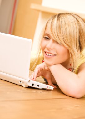 Teenage girl with laptop computer clipart