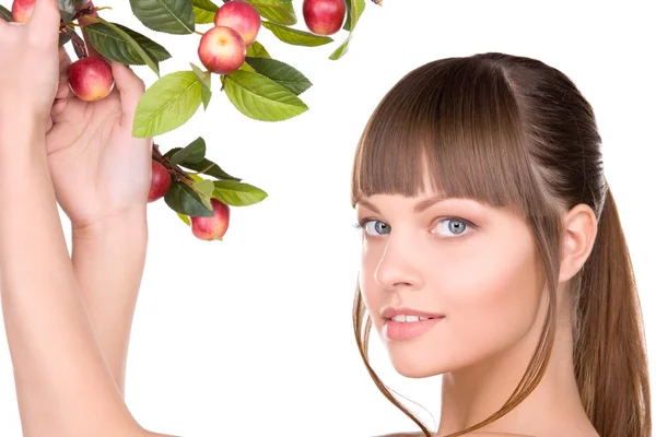 Прекрасна жінка з яблучною гілочкою — стокове фото