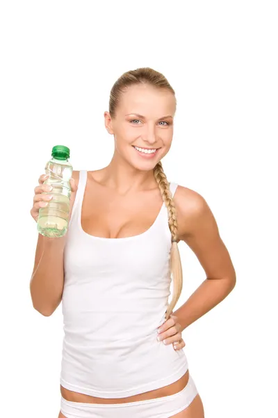 Vacker kvinna med en flaska vatten Royaltyfria Stockfoton