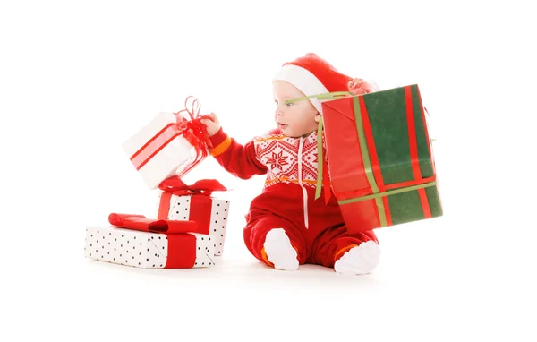 Santa pomocnik dziecko Boże Narodzenie prezenty — Zdjęcie stockowe