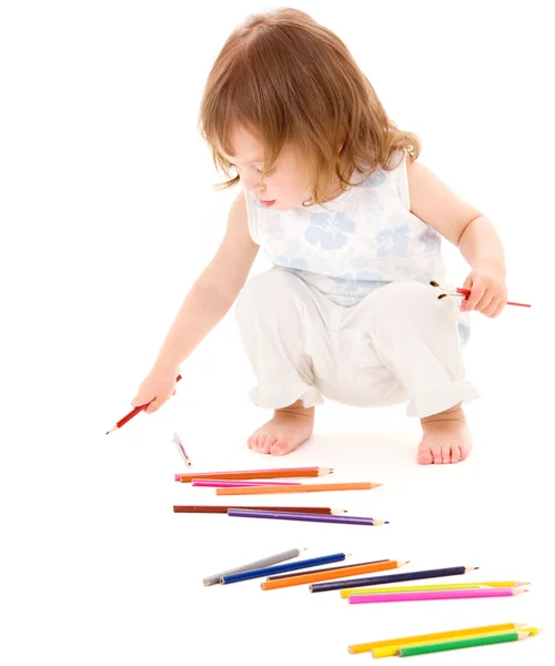 Маленька дівчинка з кольоровими олівцями — стокове фото