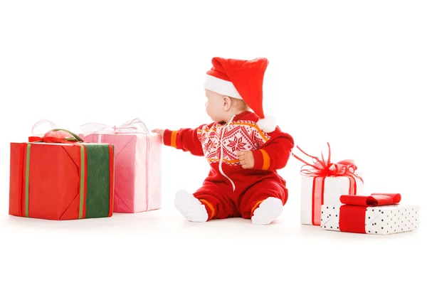 Santa helper baby met giften van Kerstmis — Stockfoto