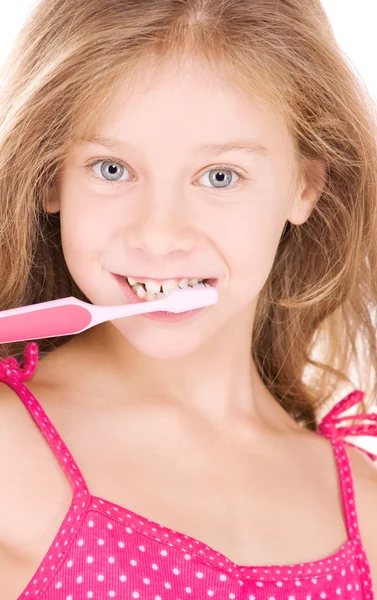 Menina feliz com escova de dentes — Fotografia de Stock