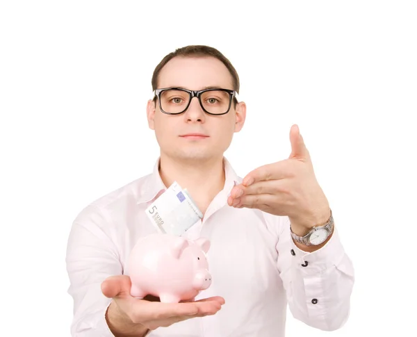 Geschäftsmann mit Sparschwein und Geld — Stockfoto