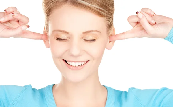 Lachende vrouw met handen over oren — Stockfoto