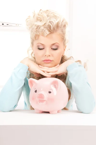 Lovely woman with piggy bank — Stock Photo, Image