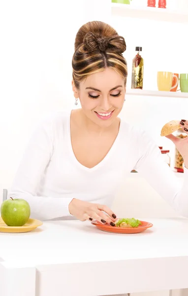 Woman with green apple and sandwich Royalty Free Stock Photos
