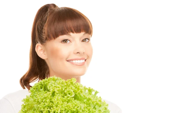 Schöne Hausfrau mit Salat über weißem — Stockfoto