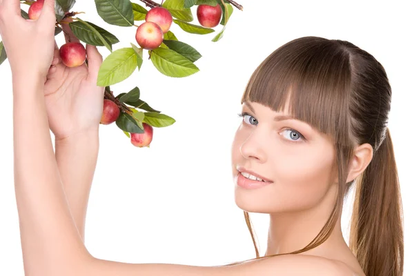 Lovely woman with apple twig Stock Photo