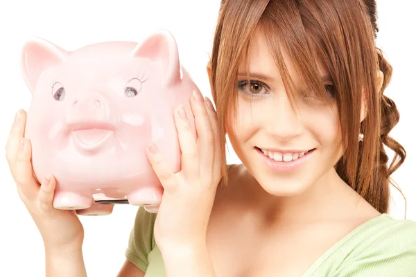 可爱少女与猪存钱罐 — 图库照片