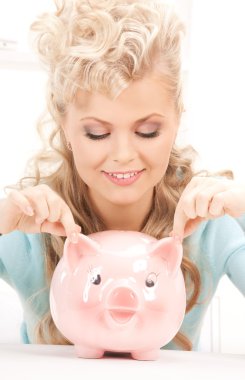 Lovely woman with piggy bank clipart