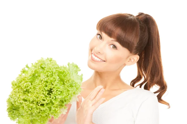 Beautiful housewife with lettuce over white — Stock Photo, Image