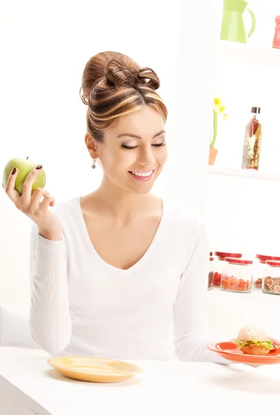 Woman with green apple and sandwich — Stock Photo, Image