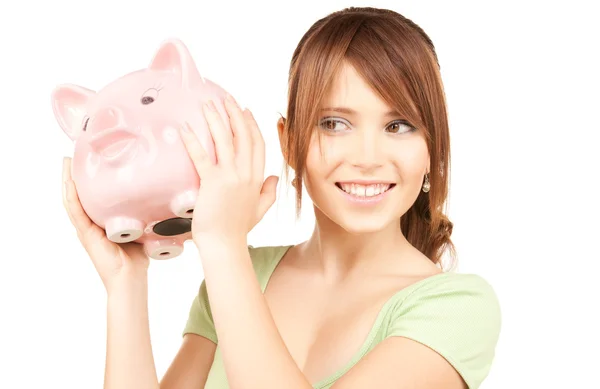 Mooie tiener meisje met piggy bank — Stockfoto