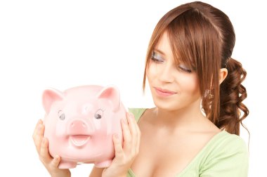 Lovely teenage girl with piggy bank clipart