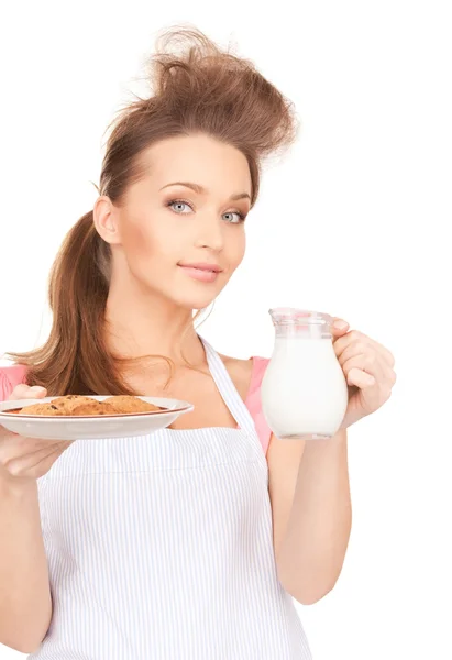 Домогосподарка з молоком і печивом — стокове фото