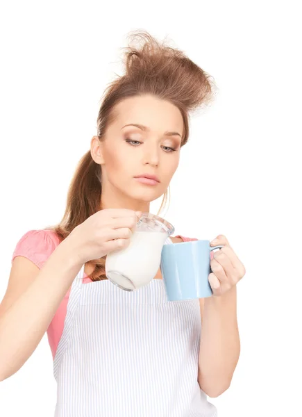 Housewife with milk and mug — Stock Photo, Image