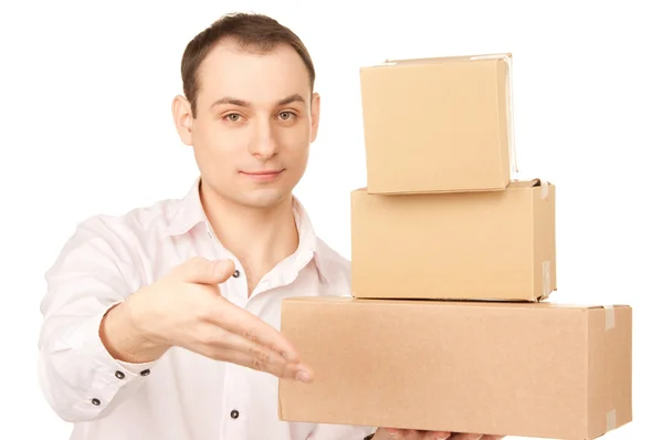 Businessman with parcels — Stock Photo, Image