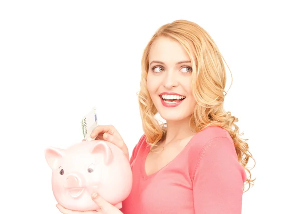 可爱的女人与猪存钱罐和钱 — 图库照片