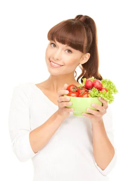Vacker hemmafru med grönsaker — Stockfoto