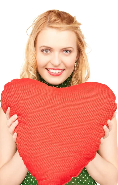 Mujer con almohada roja en forma de corazón —  Fotos de Stock