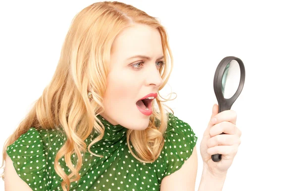 Woman with magnifying glass — Stock Photo, Image