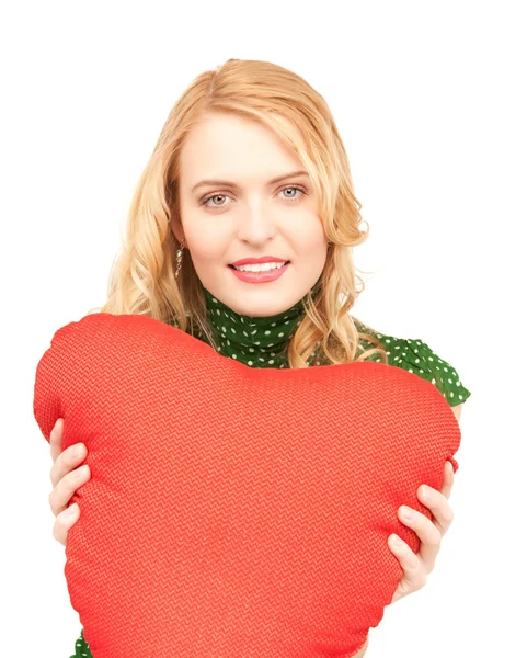 Frau mit rotem Herzkissen — Stockfoto