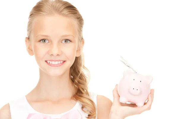 Mooie tiener meisje met piggy bank en geld — Stockfoto