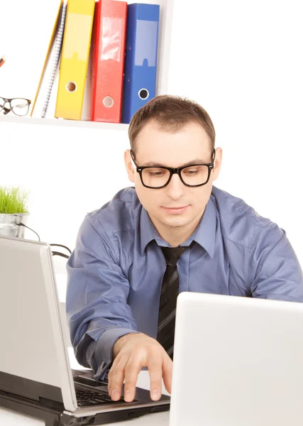 Businessman with laptop computer in office — Stock Photo, Image