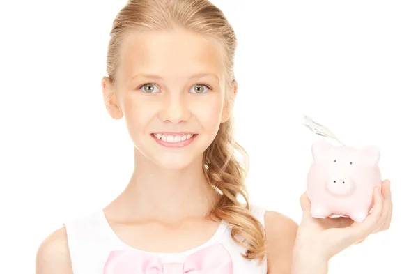 Lovely teenage girl with piggy bank and money — Stock Photo, Image