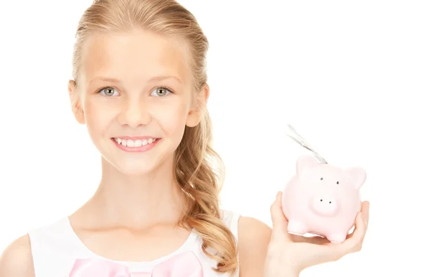 可爱少女与猪存钱罐和钱 — 图库照片