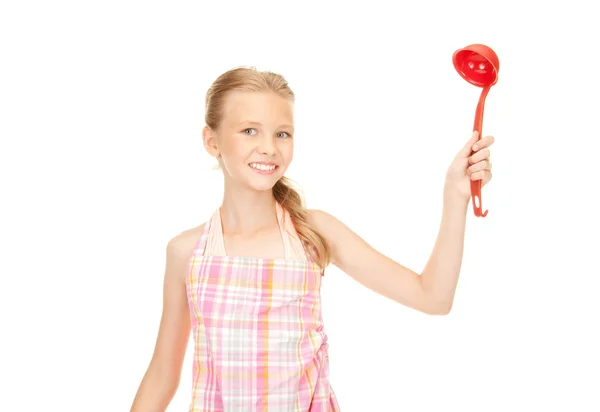 Little housewife with red ladle — Stock Photo, Image