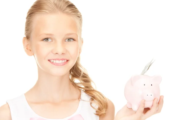 Mooie tiener meisje met piggy bank en geld — Stockfoto