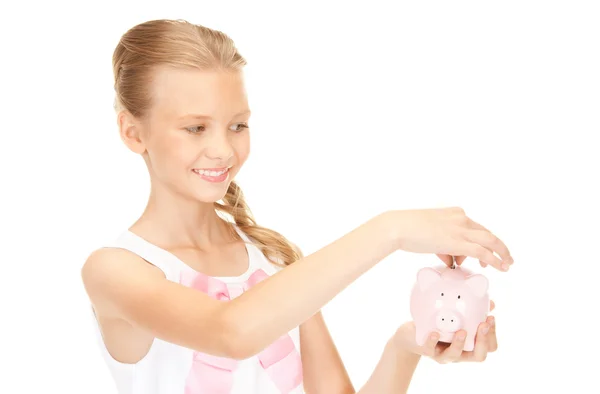 Piękne nastoletnie dziewczyny z piggy bank i pieniądze — Zdjęcie stockowe