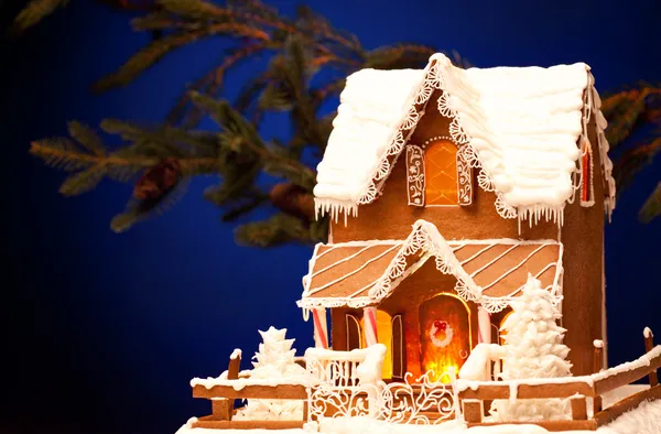 stock image Gingerbread house over christmas background