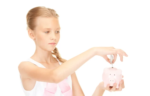 Kumbara ve parayla güzel genç kız — Stok fotoğraf