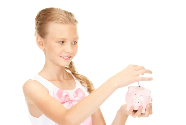 Krásné dospívající dívka s prasátko a peníze — Stock fotografie