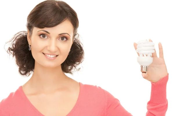 Mujer sosteniendo bombilla de ahorro de energía —  Fotos de Stock