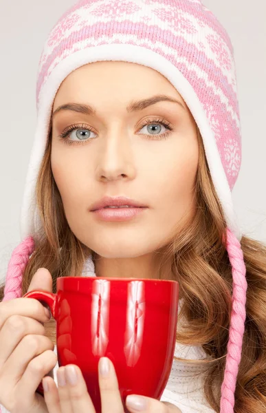 Beautiful woman with red mug — Stock Photo, Image