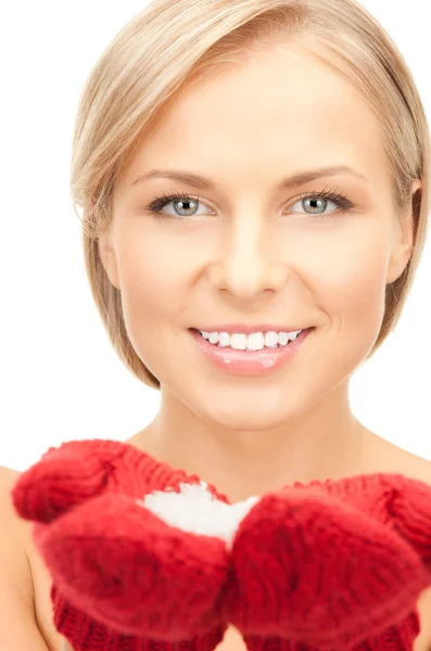 Beautiful woman in red mittens with snow — Stock Photo, Image