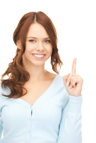Frau mit erhobenem Finger — Stockfoto