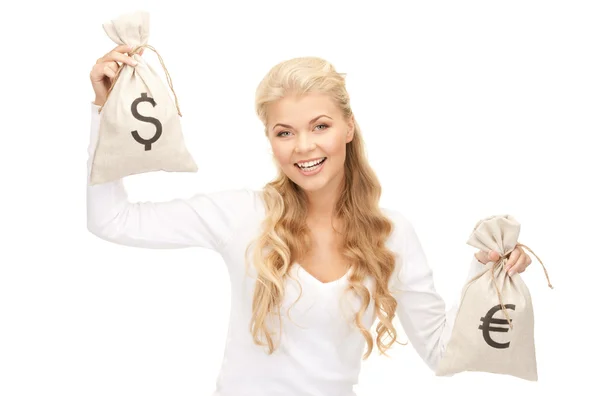 Mujer con bolsas de euro y dólar — Foto de Stock
